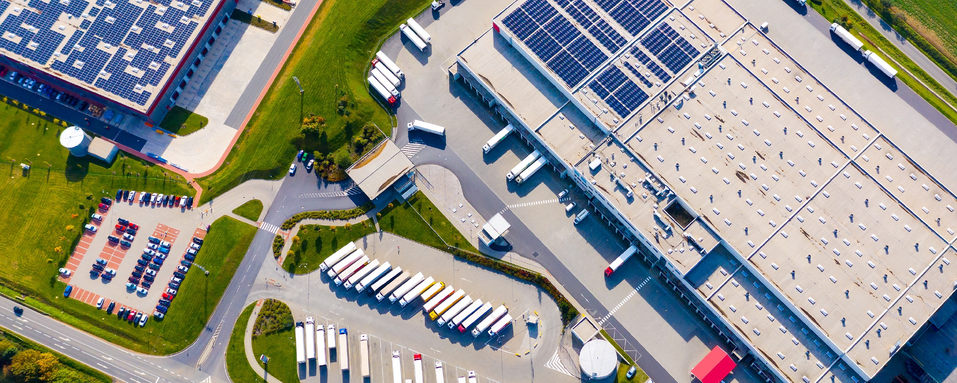 Logistics Services - Aerial view of distribution center with trucks and warehouses